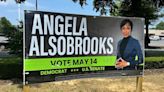 Campaign sign defaced with crosshairs drawn on candidate's head