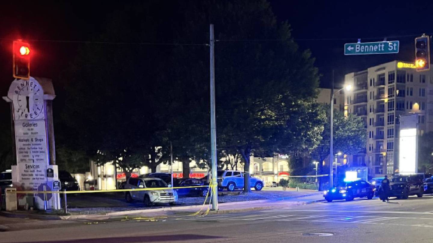 Atlanta homicide investigators at crime scene on Peachtree Road