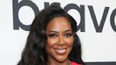 Kenya Moore Is the Definition of Chic in a White Pantsuit & Sheer Black Top (PHOTO)