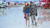 Death at Burning Man investigated as rain-soaked festival asks attendees to shelter in place