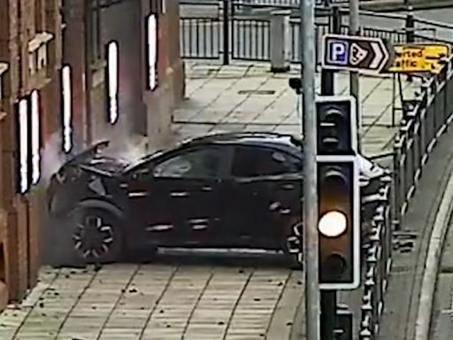 Moment man deliberately drives car into UK theatre during rush hour