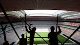 Abuse of migrant workers at Qatar World Cup stadiums continues despite reforms, report says