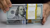 Dollar edges up as U.S. rates seen higher for longer