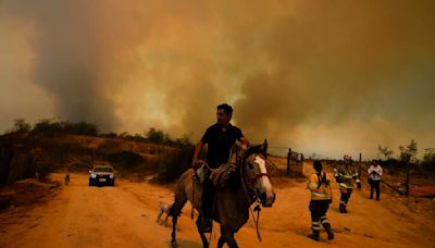 Chile accuses volunteer firefighter and ex-forestry official with causing huge fire that killed 137