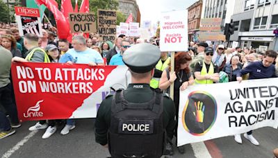 Anti-immigrant sentiment drowned out as several hundred gather to oppose racism at Belfast rally