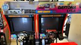 Rebels bikie charged after $400,000 found hidden in arcade game