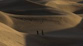 People with shovels descended on a protected sand dune after influencers said they'd buried $1,000 in a suitcase there