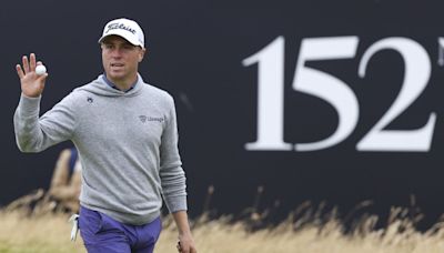 Thomas steadies himself in the wind and rain at Troon for early British Open lead