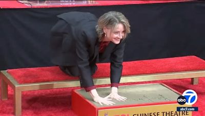 Jodie Foster goes barefoot to cement her place in Hollywood history outside TCL Chinese Theatre