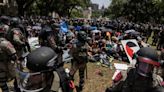 Dozens more arrested at UT-Austin as police use pepper spray, flash bangs to break up protests