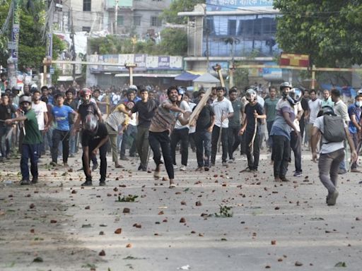 32 dead in Bangladesh unrest, protesters set fire to state TV network