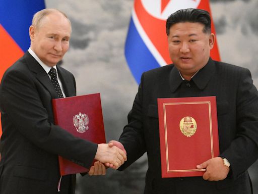 Putin and Kim Jong-un sign mutual defence pact in case of attack on Russia or North Korea