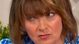 Lorraine Kelly's co-star reacts as she races into sea in plunging swimsuit