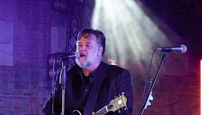 Russell Crowe shows off his vocal chops as he performs with his band