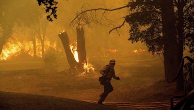 Thousands evacuate as Northern California wildfire spreads, with more hot weather expected