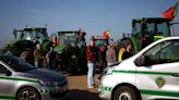 Tractor-driving Portuguese farmers block roads to Spain as protests grow