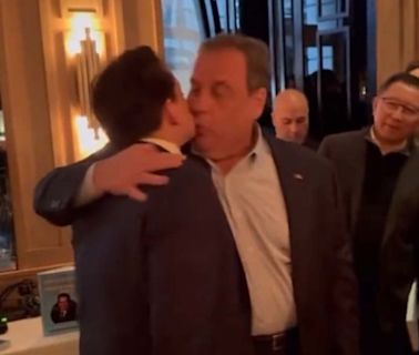 Chris Christie Embraces Former Trump Aide With Mouth Kiss