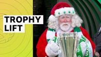 Santa Claus presents Celtic with Scottish Premiership trophy