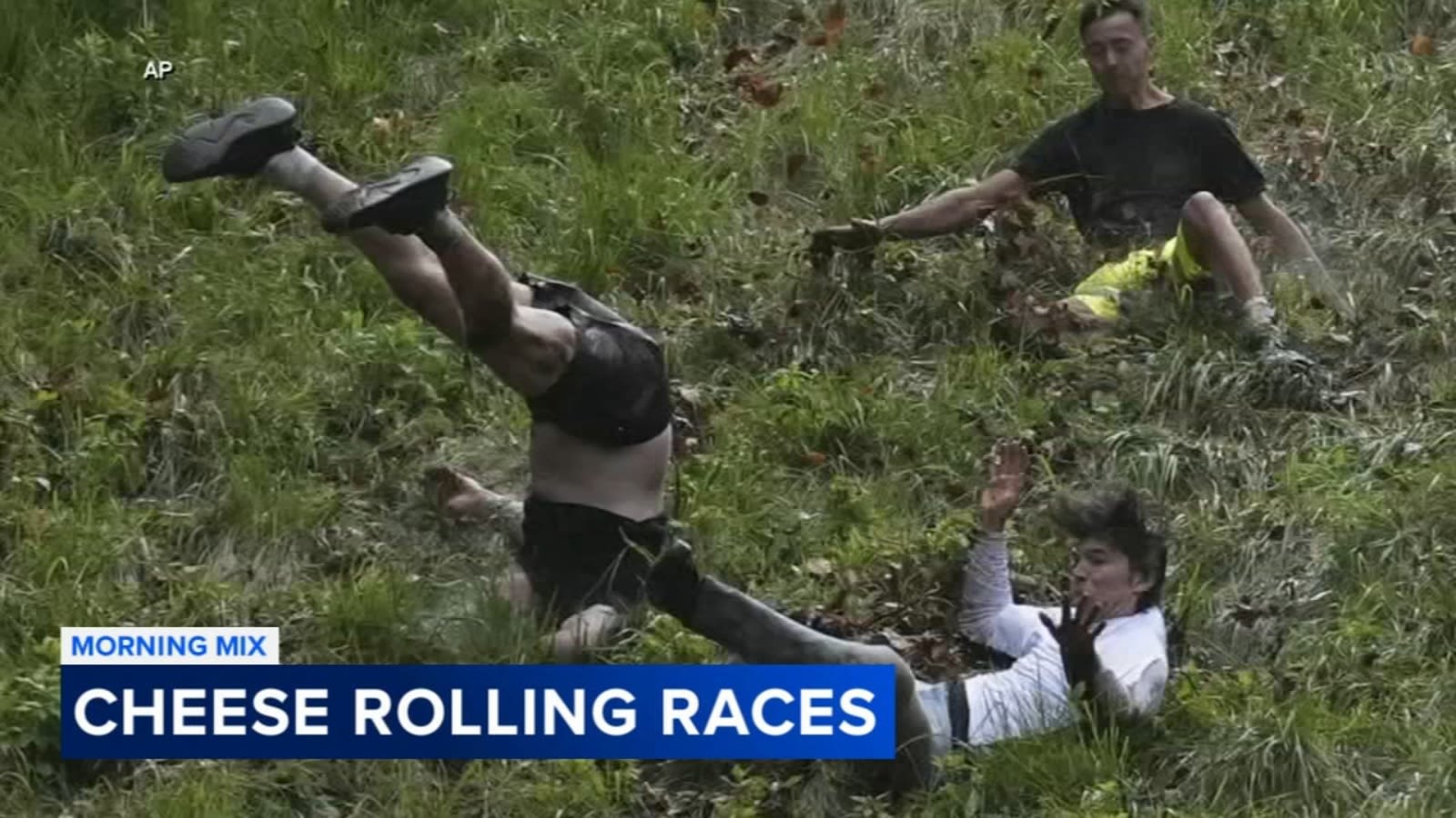 Dozens roll down Cooper's Hill in annual cheese-chasing race in England