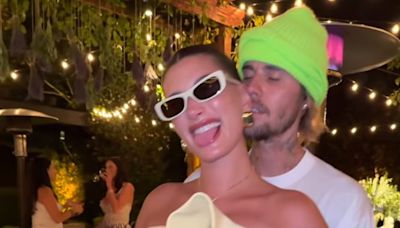 Hailey Bieber Rubs Her Baby Bump in a transparent Gown During PDA With Justin