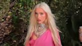 Christina Aguilera sizzles in hot pink mini dress and thigh-high boots