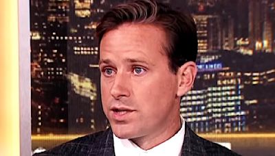 Armie Hammer DENIES that Robert Downey Jr. paid for him to go to rehab