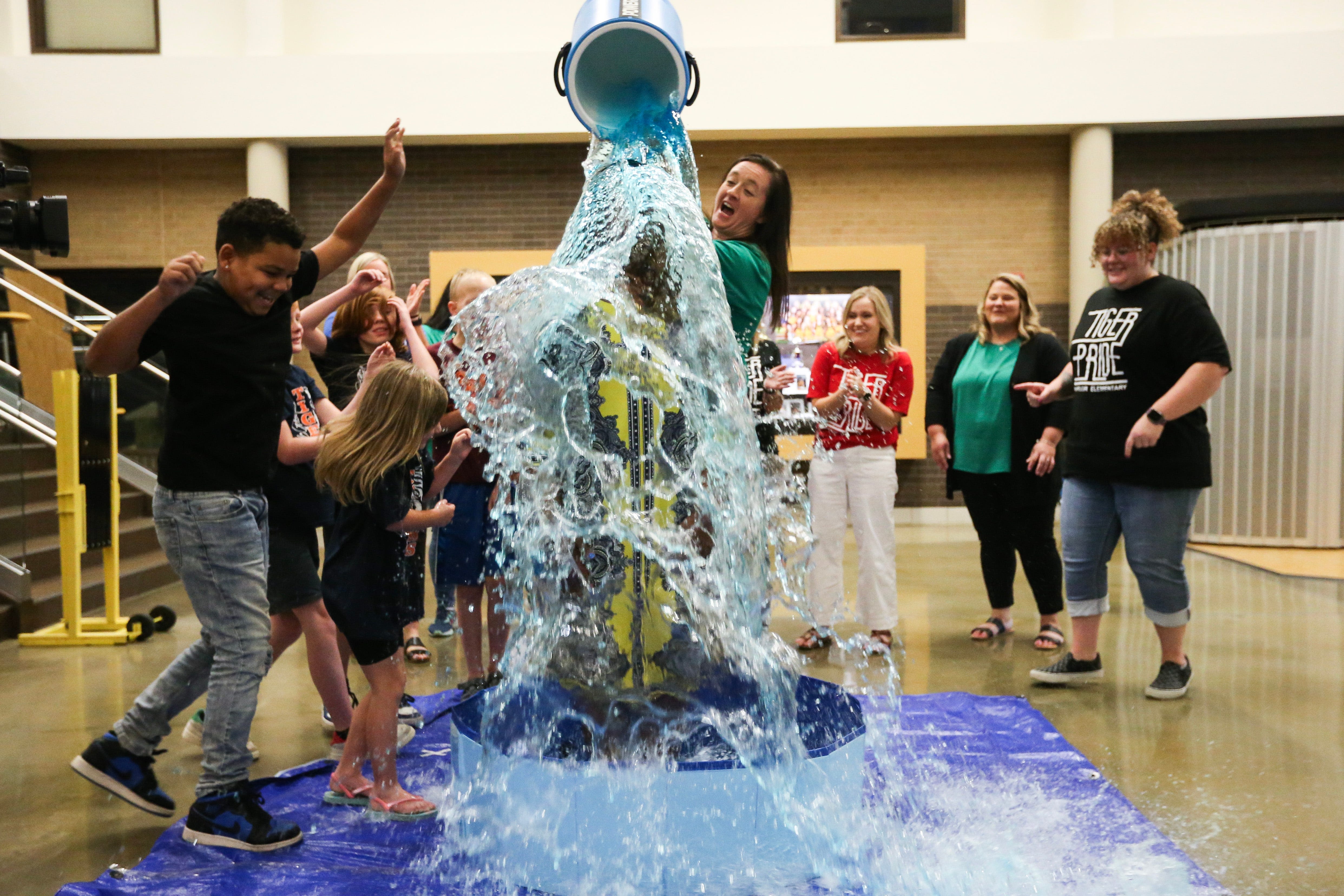 SPS superintendent celebrates higher attendance with a soaking, issues literacy challenge