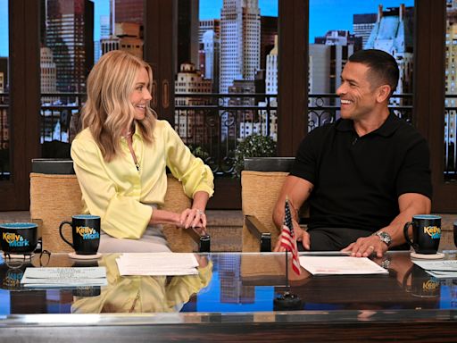 Kelly Ripa Jokes She Could Be ‘Fired’ After ‘Inappropriate’ Backstage Incident With Husband Mark Consuelos