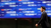 Asia stocks hit 27-month top, dollar slips on rate cut talk