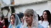 Palestinian Orthodox Christians attend Easter mass outside the church of Saint Porphyrius in Gaza City