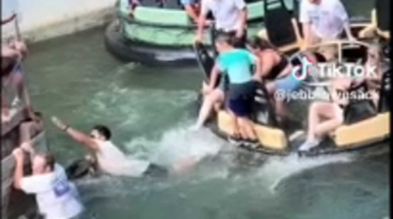 Six Flags Roaring Rapids ride malfunction leads guests to leap into the water, video shows