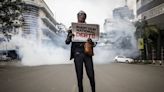 Police in Kenya use tear gas to break up new protests calling for the president to resign