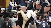 Taiwan’s parliament descends into chaos and punch-ups between MPs in ugly scenes during debate