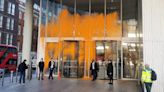 Arrests made after Just Stop Oil activists spray orange paint on buildings