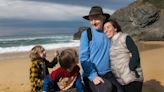 Julian Assange poses with his wife and children on Australian beach