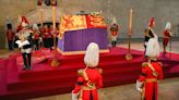 The King and his sons walk behind Queen’s coffin ahead of lying in state