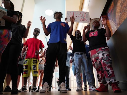 Protesters shut down Aurora community meeting, calling for police accountability in shooting death of Kilyn Lewis