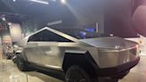 Watch new videos of Tesla's Cybertruck that show off new features — including its 'vault' and no door handles