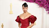 Liza Koshy trips and takes a tumble on the Oscars red carpet. See the moment