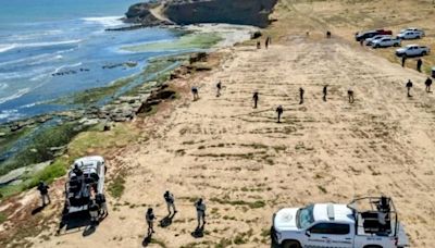 Slain Australian surfers' bodies arrive in U.S. on journey home