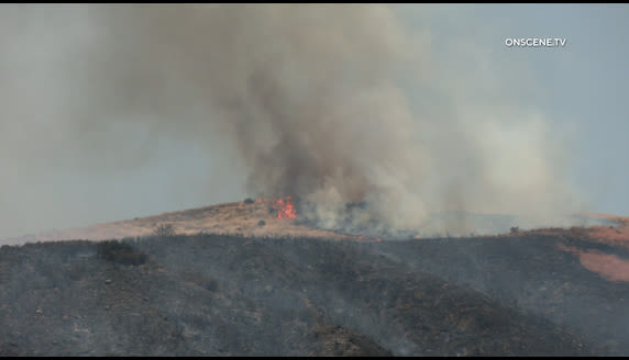 Brush fire prompts evacuation warning in Riverside County