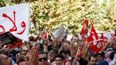 Thousands from rival Tunisian parties protest against president