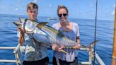 Tuna boats corral yellowfin tuna in deep blue water 70 miles offshore