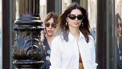 Emily Ratajkowski flashes nude bra as she forgets to button up shirt