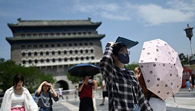 中國北方高溫多地破40℃ 南方暴雨或現洪水