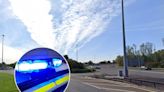 Motorist hospitalised as crash part closes major roundabout