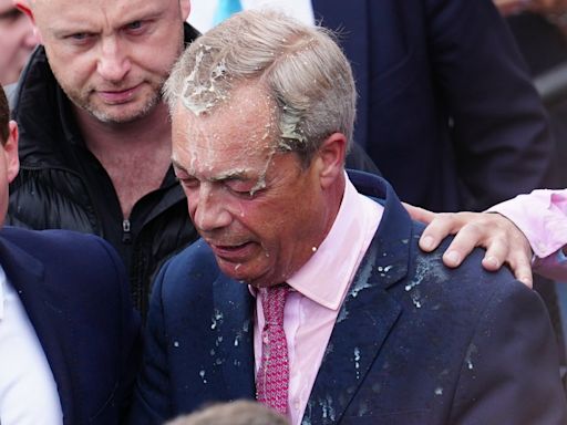 Two people arrested after milkshake thrown over Nigel Farage as he launched general election campaign