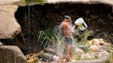 A scorching heat wave kills 14 in India ahead of a final round of election voting on Saturday