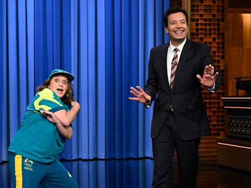 Rachel Dratch busts a move to parody Olympic breakdancer Raygun while crashing Jimmy Fallon’s monologue