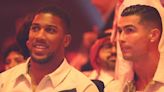 Anthony Joshua sits beside Cristiano Ronaldo at ringside to watch Fury vs Usyk